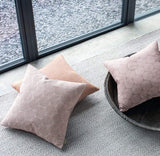 Recycled plastic bottle rug, Tibba Sand Rug with cushions in front of large window