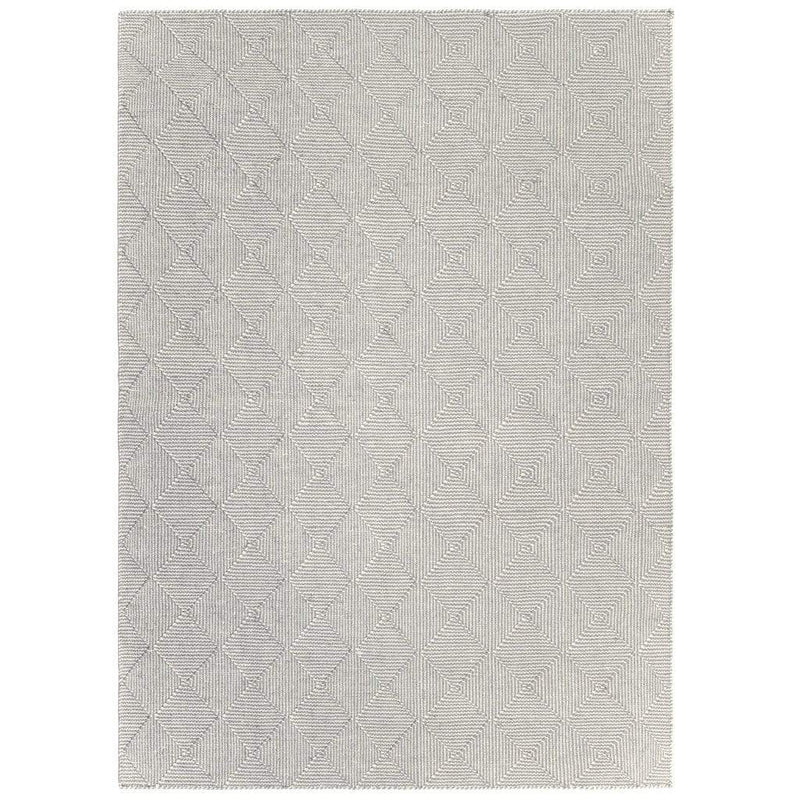 Zala Slate Rug is a recycled rug handwoven from 100% repurposed plastic bottles.  This recycled flat weave rug features a diamond weave pattern in pale grey and neutral yarns. Full recycled rug shown.