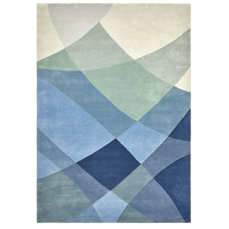 Rhythmic Tides Rug is a modern ocean themed rug that celebrates the sea. This coast rug is blue-green in colour and has an organic curved pattern which depicts the ebb and flow of the tides. Product image.