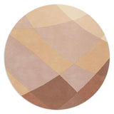 Rhythmic Tides Sand Round Rug is designed in warm earthy terracotta and pink colours and features a curved pattern to depict the ebb and flow of the tides.