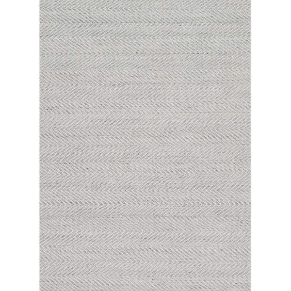 Tibba Sand Rug is a natural coloured recycled rug handwoven from 100% repurposed plastic bottles. Herringbone-style rug that looks and feels just like wool. Product close up. 
