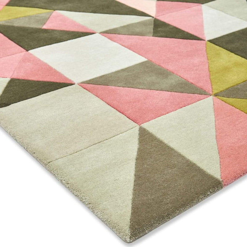 Tielles Rose Rug is a modern geometric rug which features a beautiful mix of pink, green and greys. Detail close up.