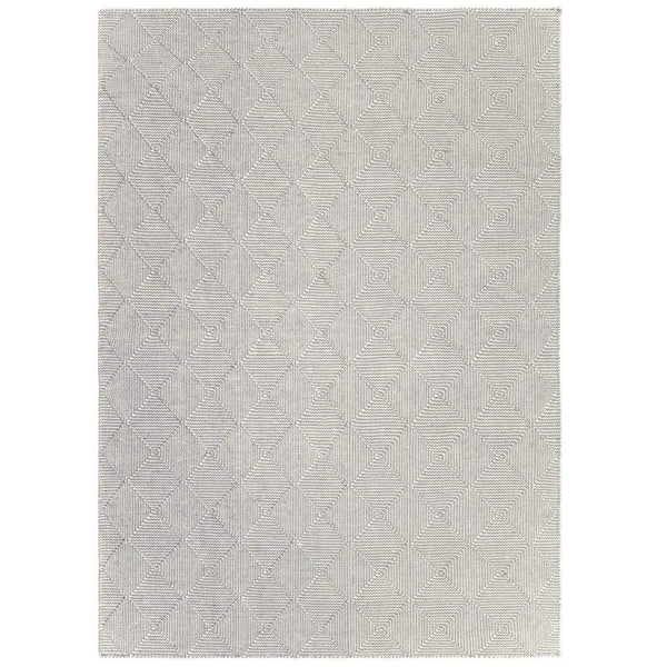 Zala Slate Rug is a recycled rug handwoven from 100% repurposed plastic bottles.  This recycled flat weave rug features a diamond weave pattern in pale grey and neutral yarns. Full recycled rug shown.